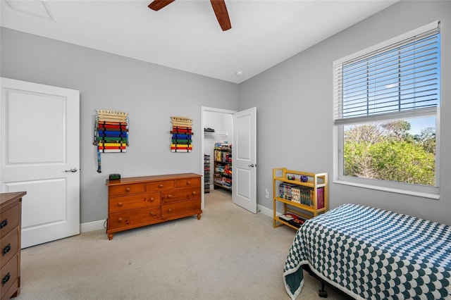 bedroom featuring ceiling fan, baseboards, visible vents, and light carpet