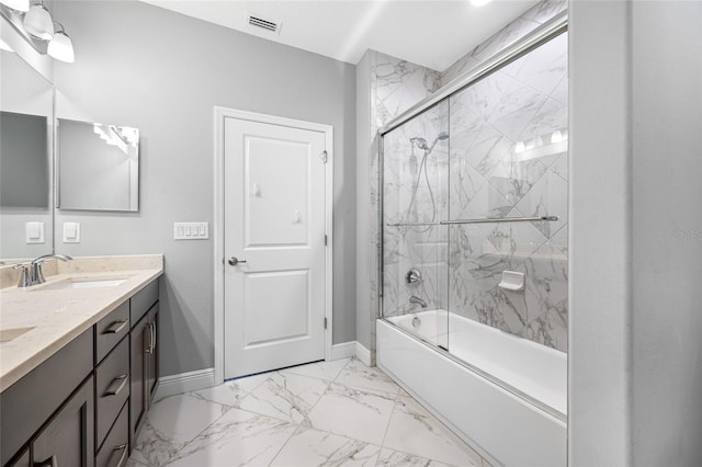 full bathroom featuring visible vents, marble finish floor, a sink, shower / bath combination with glass door, and baseboards