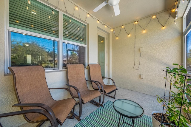 sunroom / solarium featuring ceiling fan