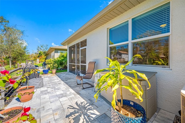 view of patio / terrace with a sunroom