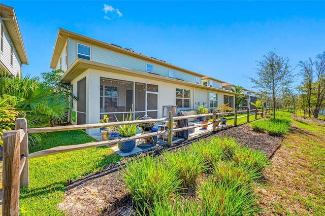 back of house with a sunroom