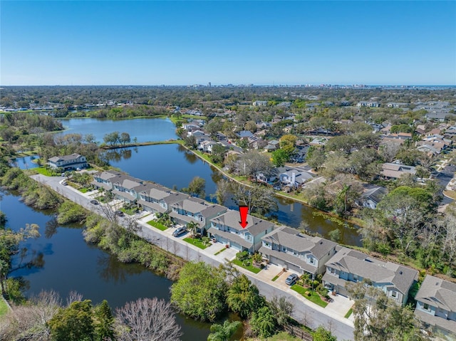 drone / aerial view with a residential view and a water view