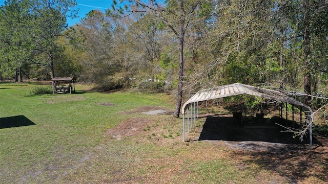 view of yard featuring a gazebo and a detached carport