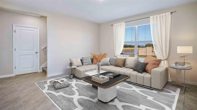 living room with tile patterned flooring, stairway, and baseboards