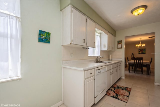 kitchen featuring light tile patterned flooring, a sink, light countertops, backsplash, and dishwasher