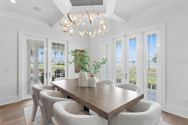 dining area featuring wood finished floors, baseboards, french doors, beamed ceiling, and crown molding