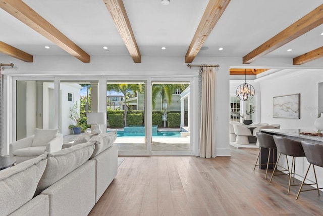 living area featuring light wood-style flooring, beam ceiling, and recessed lighting