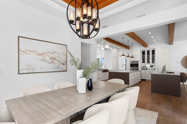 dining area featuring visible vents, ornamental molding, beam ceiling, dark wood-style floors, and an inviting chandelier