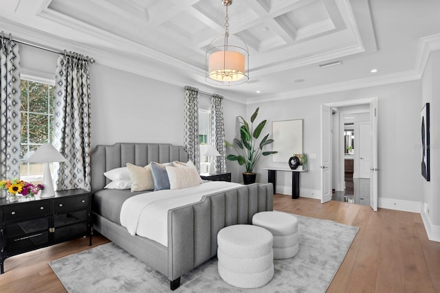 bedroom with coffered ceiling, visible vents, baseboards, hardwood / wood-style floors, and crown molding