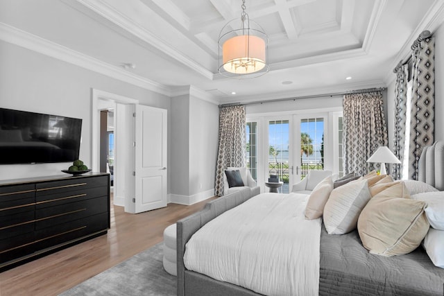 bedroom with french doors, coffered ceiling, crown molding, and wood finished floors