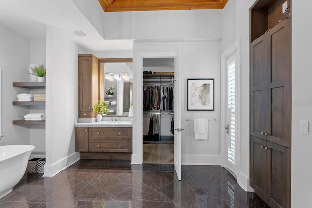 interior space featuring marble finish floor and baseboards