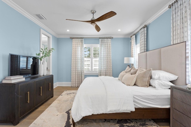 bedroom featuring light wood-type flooring, ornamental molding, and recessed lighting