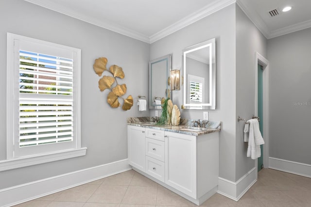 full bath featuring tile patterned flooring, visible vents, baseboards, double vanity, and crown molding