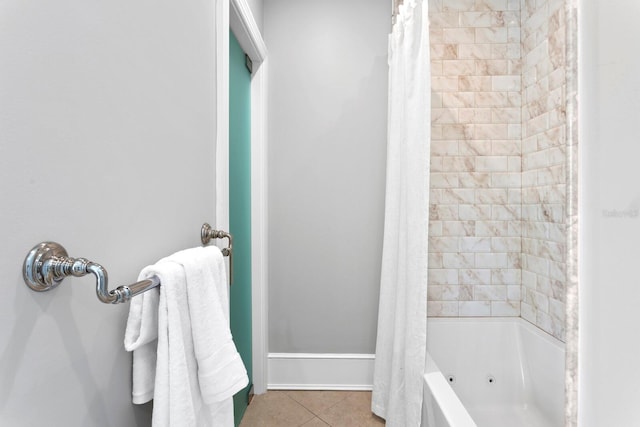 bathroom featuring shower / tub combo and tile patterned flooring