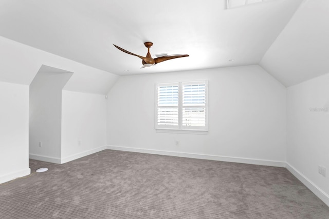 additional living space with lofted ceiling, ceiling fan, carpet floors, and baseboards