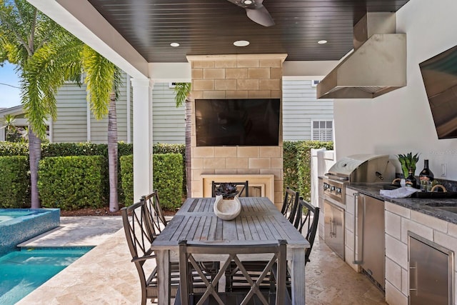 view of patio featuring an outdoor pool, an outdoor kitchen, a ceiling fan, grilling area, and outdoor dining space