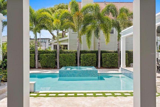 view of pool featuring a pool with connected hot tub