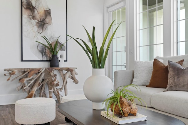 interior space with wood finished floors and baseboards