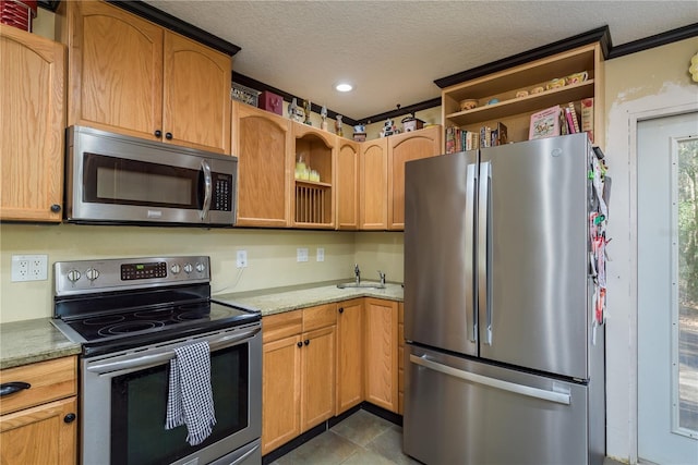 kitchen with light stone counters, open shelves, stainless steel appliances, a textured ceiling, and tile patterned flooring