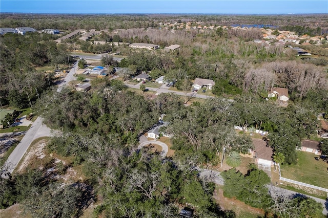 birds eye view of property with a wooded view