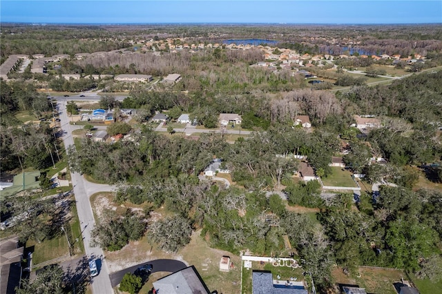 birds eye view of property with a forest view