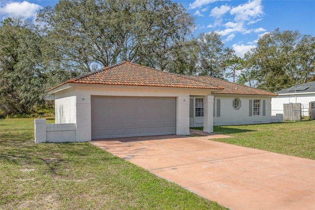 view of front of home featuring a garage, a tiled roof, fence, a front lawn, and stucco siding