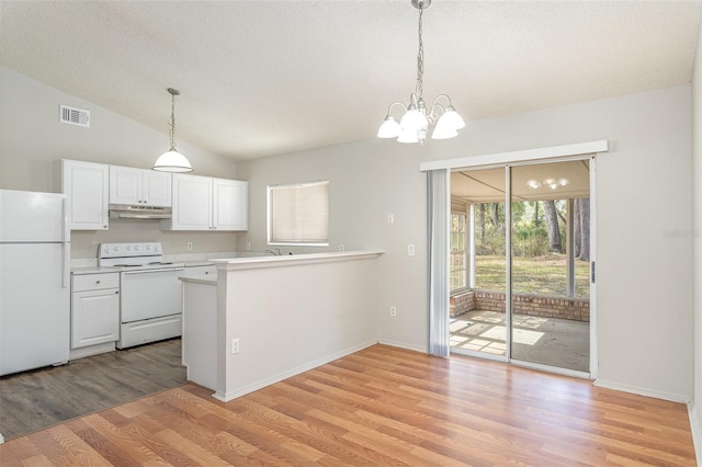 kitchen featuring white appliances, visible vents, white cabinets, light countertops, and under cabinet range hood