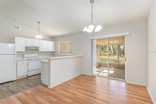 kitchen featuring white appliances, white cabinets, a peninsula, light countertops, and under cabinet range hood