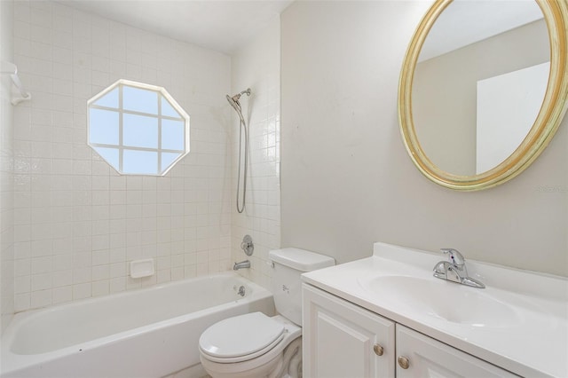 bathroom featuring bathtub / shower combination, vanity, and toilet