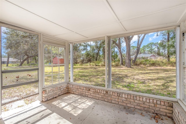 unfurnished sunroom featuring a wealth of natural light