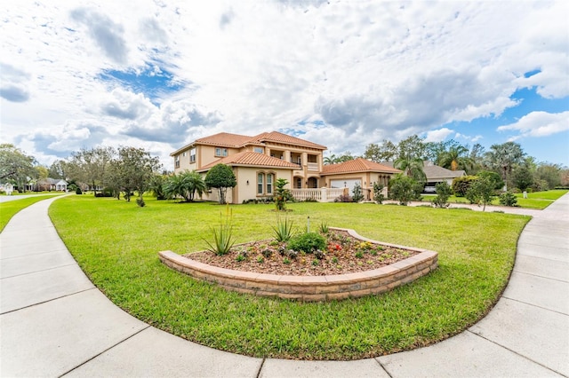 exterior space with a tile roof, a front lawn, and stucco siding