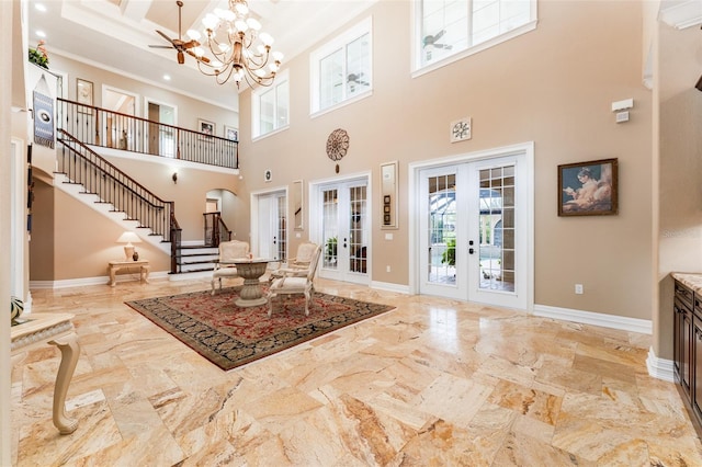 entrance foyer featuring a notable chandelier, baseboards, stairs, french doors, and crown molding