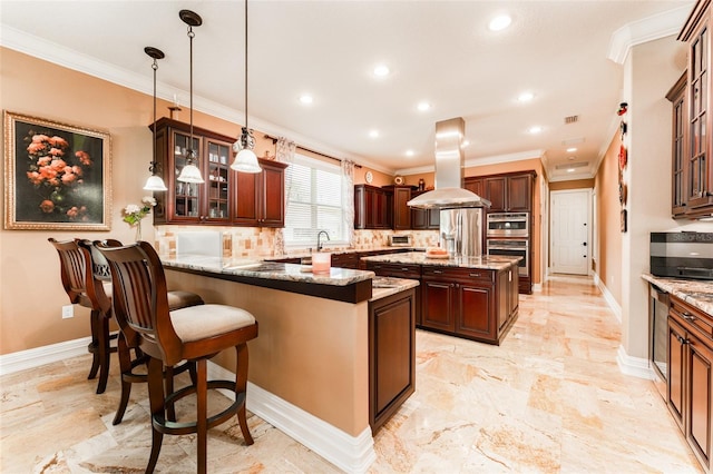 kitchen featuring stainless steel appliances, decorative backsplash, ornamental molding, island range hood, and a peninsula