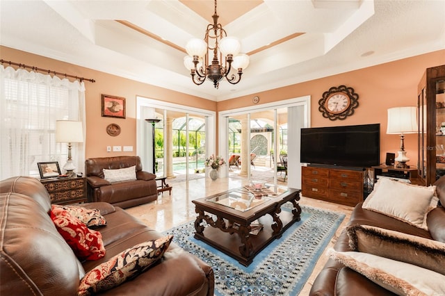 living room featuring a chandelier, a raised ceiling, and crown molding