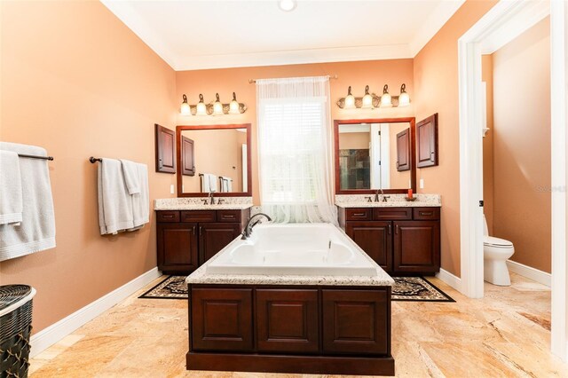 full bath featuring baseboards, toilet, two vanities, a sink, and a bath