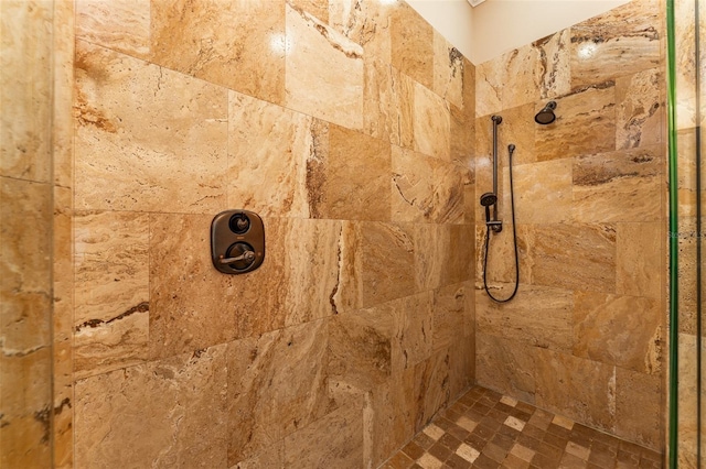 bathroom with tiled shower