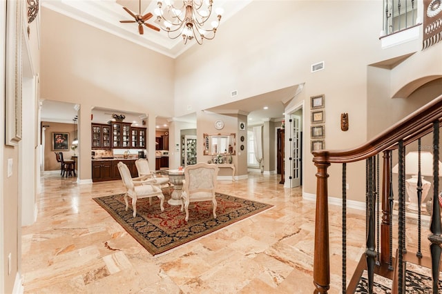 entryway featuring stairway, visible vents, ornamental molding, and baseboards