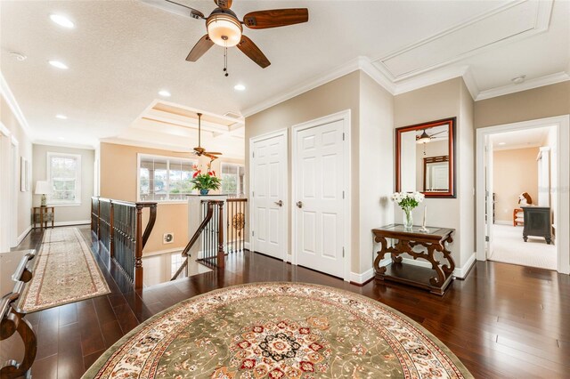 foyer with ornamental molding, recessed lighting, hardwood / wood-style floors, and baseboards