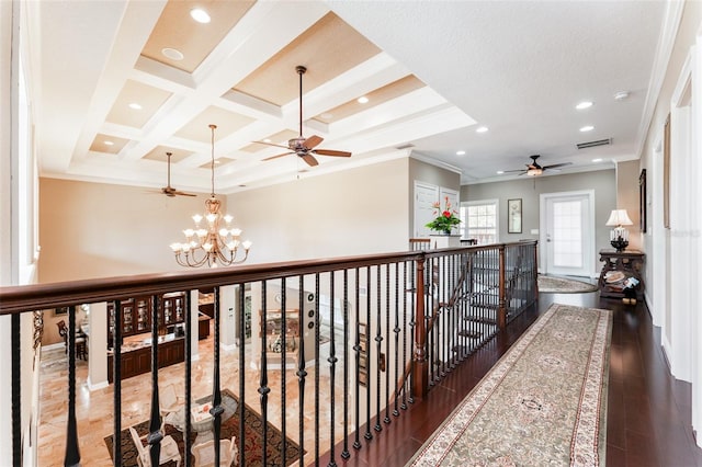 hall with recessed lighting, visible vents, ornamental molding, a chandelier, and coffered ceiling