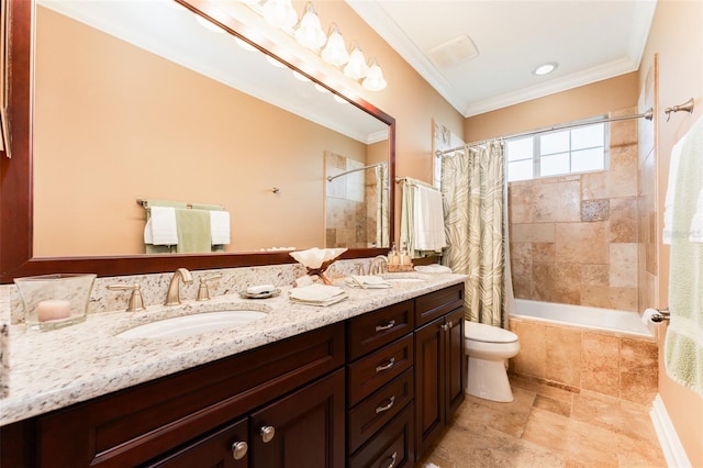 bathroom with tiled shower / bath, double vanity, a sink, and crown molding