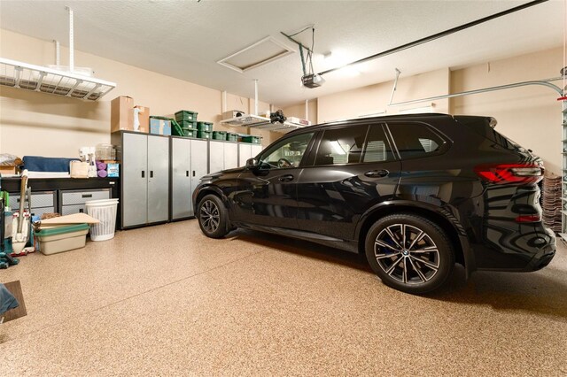 garage featuring a garage door opener