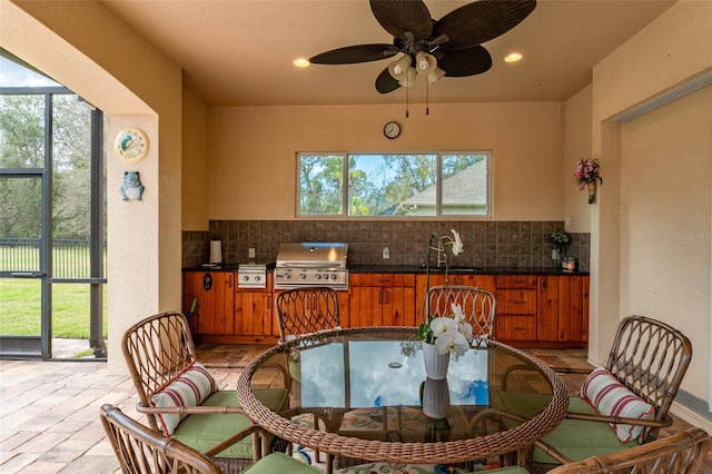 kitchen with brown cabinetry, dark countertops, and decorative backsplash