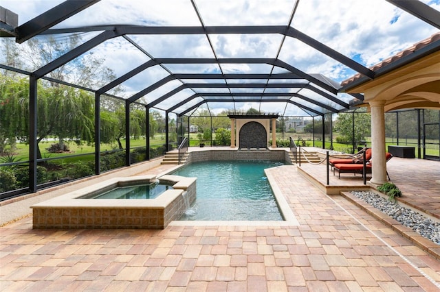 view of swimming pool with a lanai, a patio area, and a pool with connected hot tub