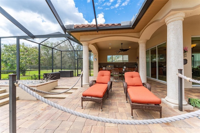 view of patio featuring a lanai, an outdoor hangout area, outdoor dining area, and a ceiling fan