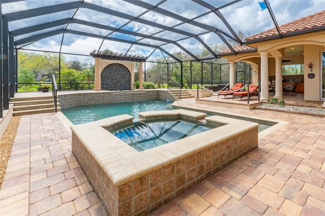 view of pool with glass enclosure, a pool with connected hot tub, and a patio area