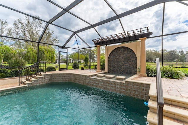 outdoor pool with a lanai and a patio area