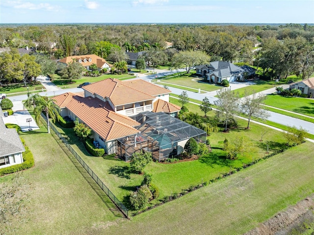 aerial view featuring a residential view and a wooded view