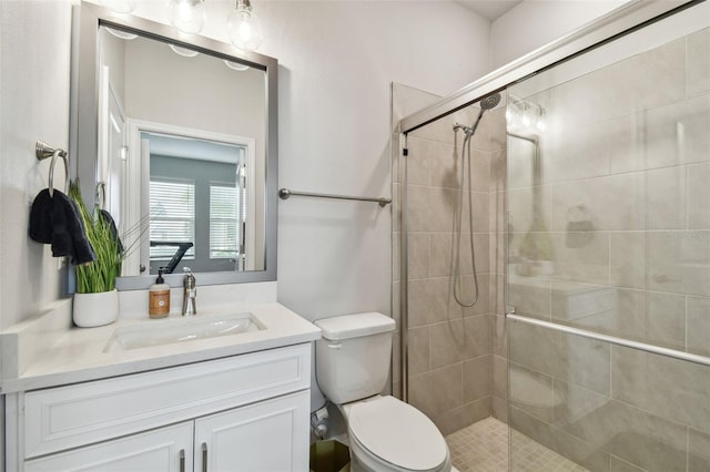 full bath with toilet, a shower stall, and vanity