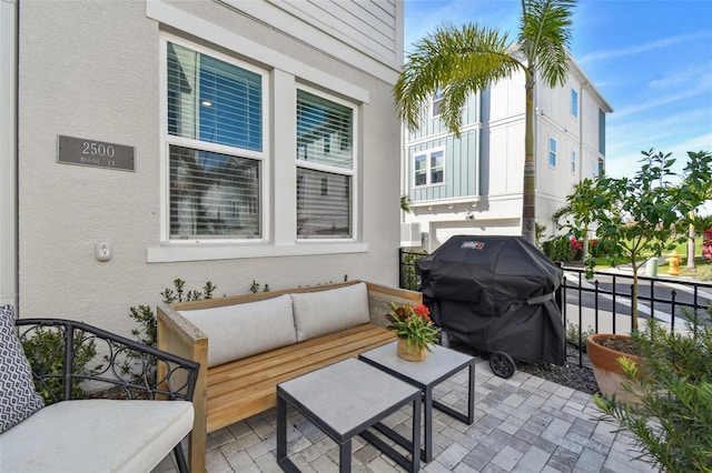 view of patio with a grill and an outdoor hangout area