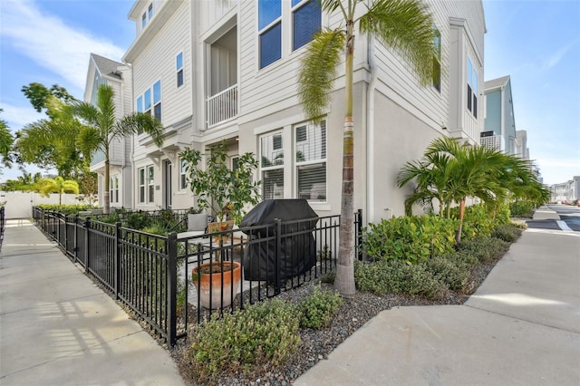 view of property with fence